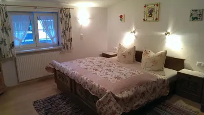 Ein Bett oder Betten in einem Zimmer der Unterkunft Schusterhof