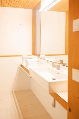 Ein Badezimmer in der Unterkunft Aparthotel Hubertus Mellau