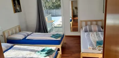 Ein Bett oder Betten in einem Zimmer der Unterkunft Dimai House No 15 Dornbirn Zentrum