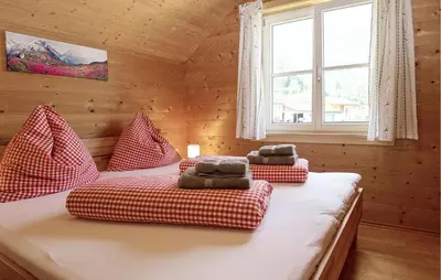 Ein Bett oder Betten in einem Zimmer der Unterkunft Ferienhaus Dalaas Am Arlberg