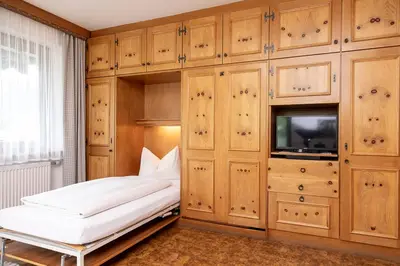 Ein Bett oder Betten in einem Zimmer der Unterkunft Gästehaus Etschmann