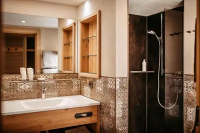 Ein Badezimmer in der Unterkunft Hotel Leitner