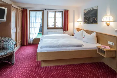 Ein Bett oder Betten in einem Zimmer der Unterkunft Gästehaus Walserheimat