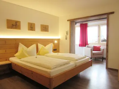 Ein Bett oder Betten in einem Zimmer der Unterkunft Hotel Alpensonne