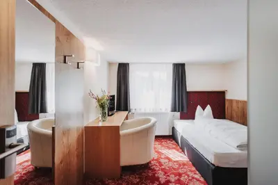 Ein Bett oder Betten in einem Zimmer der Unterkunft Hotel Adler