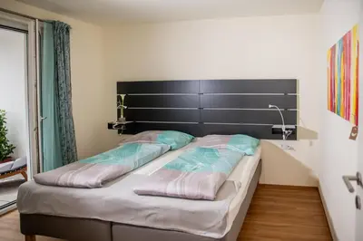 Ein Bett oder Betten in einem Zimmer der Unterkunft Cityapartment Dornbirn 50qm zentral in Bahnhofsnähe mit TG