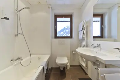 Ein Badezimmer in der Unterkunft Hotel Bergheim