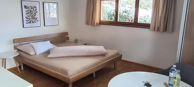 Ein Bett oder Betten in einem Zimmer der Unterkunft Ferienwohnung Geismayr
