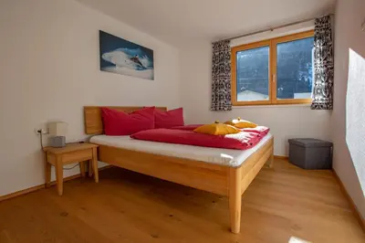 Ein Bett oder Betten in einem Zimmer der Unterkunft Ferienwohnung Wallner