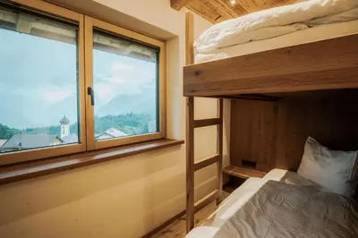 Ein Bett oder Betten in einem Zimmer der Unterkunft Rufana Alpin
