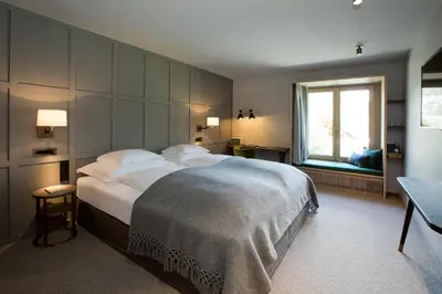 Ein Bett oder Betten in einem Zimmer der Unterkunft Hotel Berghof