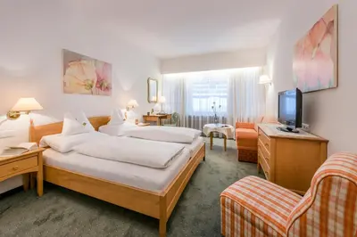 Ein Bett oder Betten in einem Zimmer der Unterkunft Cresta.Alpin.Sport.Hotel