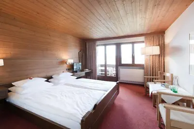 Ein Bett oder Betten in einem Zimmer der Unterkunft Krone Hittisau - Hotel & Restaurant im Bregenzerwald