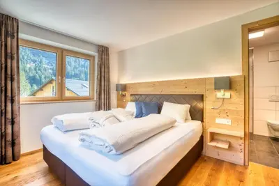 Ein Bett oder Betten in einem Zimmer der Unterkunft HUS23 with Wellness