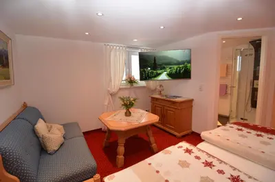 Ein Bett oder Betten in einem Zimmer der Unterkunft Gästehaus am Berg