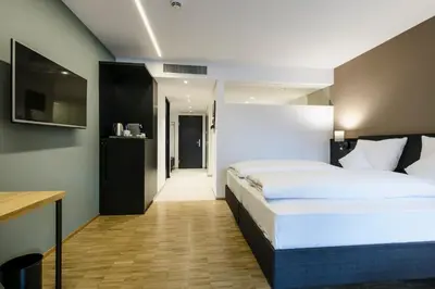 Ein Bett oder Betten in einem Zimmer der Unterkunft Montfort - das Hotel