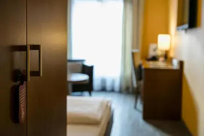 Ein Bett oder Betten in einem Zimmer der Unterkunft Montfort - das Hotel