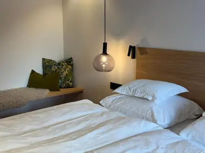 Ein Bett oder Betten in einem Zimmer der Unterkunft Almrösle Apartments
