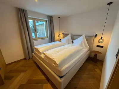 Ein Bett oder Betten in einem Zimmer der Unterkunft Almrösle Apartments