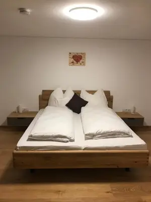 Ein Bett oder Betten in einem Zimmer der Unterkunft Murmenta Appartements