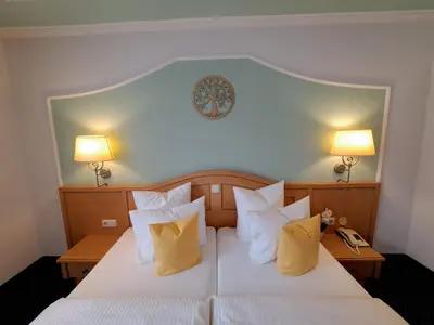 Ein Bett oder Betten in einem Zimmer der Unterkunft Schedlers Löwenhotel-GARNI