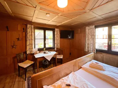 Ein Bett oder Betten in einem Zimmer der Unterkunft D`Alpenapartments Bezau