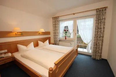 Ein Bett oder Betten in einem Zimmer der Unterkunft Gästehaus Annette