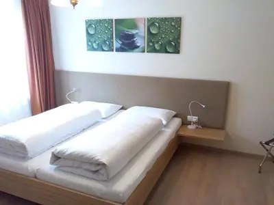 Ein Bett oder Betten in einem Zimmer der Unterkunft Der Löwen, Löwen Betriebs- und Management GmbH