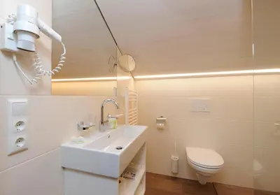 Ein Badezimmer in der Unterkunft BOUTIQUEHOTEL das edelweiss