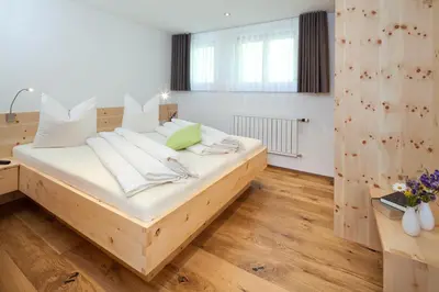 Ein Bett oder Betten in einem Zimmer der Unterkunft Aparthotel Brunnenhof