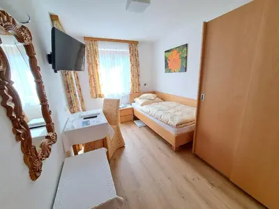 Ein Bett oder Betten in einem Zimmer der Unterkunft Pension Mallaun
