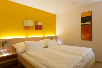 Ein Bett oder Betten in einem Zimmer der Unterkunft Alpenappartement Bergkönig