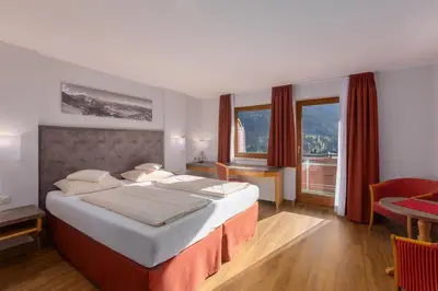 Ein Bett oder Betten in einem Zimmer der Unterkunft IFA Alpenrose Hotel Kleinwalsertal