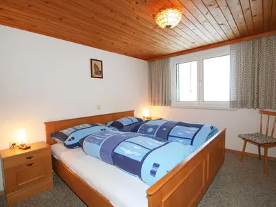 Ein Bett oder Betten in einem Zimmer der Unterkunft Apartment Mangeng-2 by Interhome