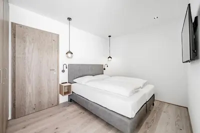 Ein Bett oder Betten in einem Zimmer der Unterkunft Alpenstern Panoramalodge