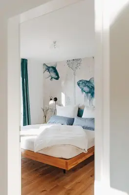 Ein Bett oder Betten in einem Zimmer der Unterkunft Rotes Haus Bregenz See Wohnung