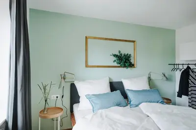 Ein Bett oder Betten in einem Zimmer der Unterkunft Rotes Haus Bregenz Wald Wohnung
