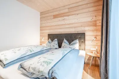 Ein Bett oder Betten in einem Zimmer der Unterkunft Naturhaus am Arlberg