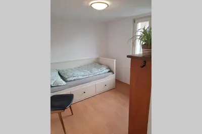 Ein Bett oder Betten in einem Zimmer der Unterkunft Ferienwohnung am Hatler Brunnen