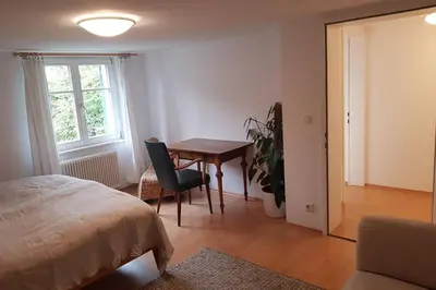 Ein Bett oder Betten in einem Zimmer der Unterkunft Ferienwohnung am Hatler Brunnen