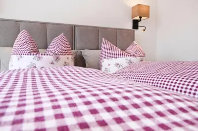 Ein Bett oder Betten in einem Zimmer der Unterkunft Panoramahof Bergglück