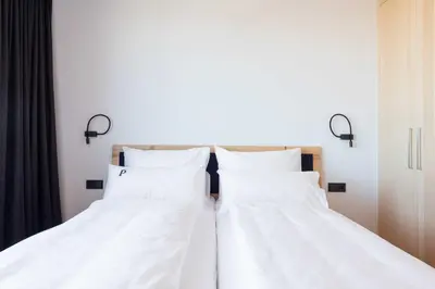 Ein Bett oder Betten in einem Zimmer der Unterkunft Apartments Pôldi