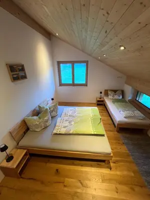 Ein Bett oder Betten in einem Zimmer der Unterkunft Ferienwohnung Berchtold