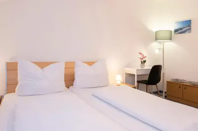 Ein Bett oder Betten in einem Zimmer der Unterkunft Haus Sahin