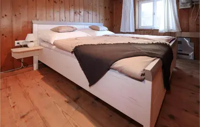 Ein Bett oder Betten in einem Zimmer der Unterkunft Großes Ferienhaus Dalaas
