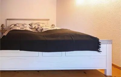 Ein Bett oder Betten in einem Zimmer der Unterkunft Großes Ferienhaus Dalaas