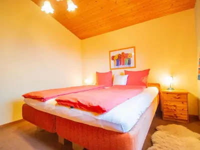 Ein Bett oder Betten in einem Zimmer der Unterkunft Chalet The Schatzie by Interhome