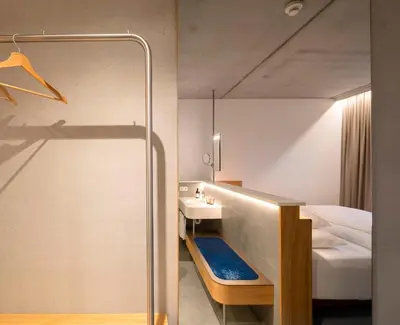 Ein Bett oder Betten in einem Zimmer der Unterkunft FIRMAMENT Hotel