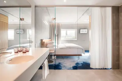 Ein Bett oder Betten in einem Zimmer der Unterkunft FIRMAMENT Hotel