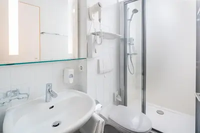 Ein Badezimmer in der Unterkunft 4-Länder-Hotel Deutschmann